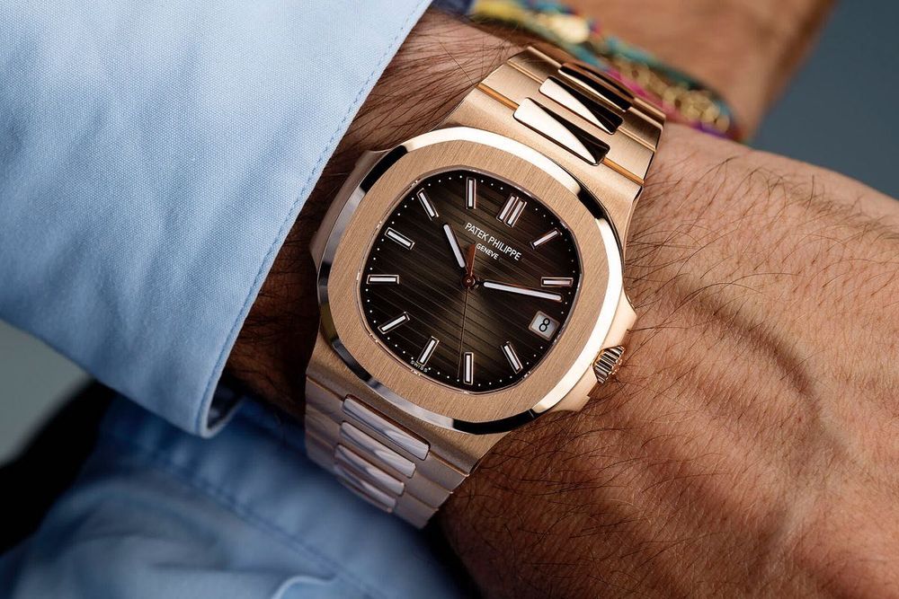 Часовници Rolex , Patek Philippe