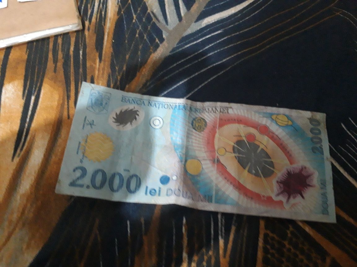 Bacnota de 2000 lei cu eclipsa din 1999