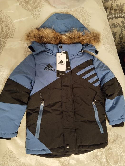 Продам новую зимнию куртку комбинезон