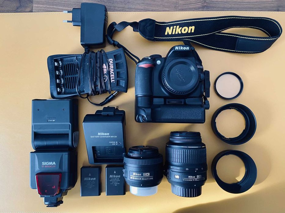 Nikon D3100 + 2 obiective (18-55 VR, 35/1.8G) + blitz, 11.800 cadre