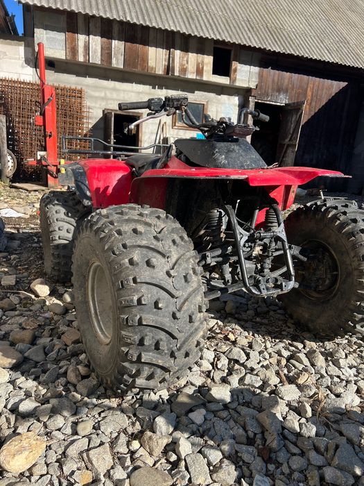 vând atv kawasaki 300