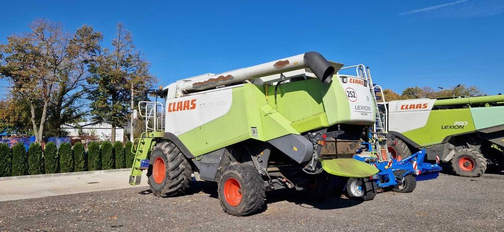 Combina CLAAS Lexion 570 + Heder Paioase 7,5m – 290 kW – An 2010