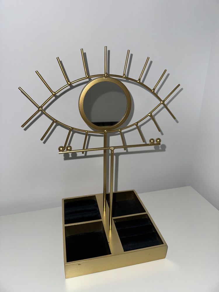 Oglinda in forma de ochi cu suport pentru bijuterii auriu