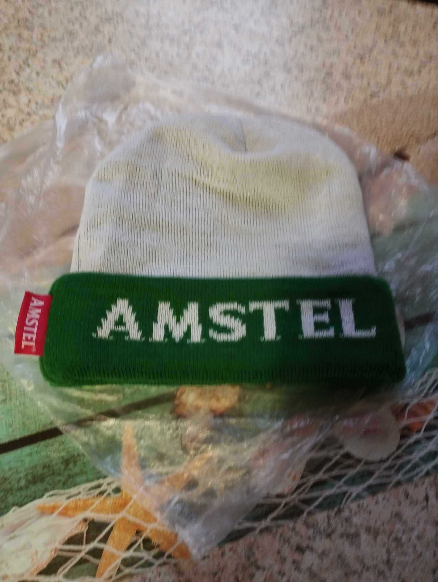 Нова зимна шапка,рекламна на Амател.Цена 15лв.