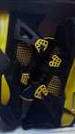 Jordan 4 black yellow thunder