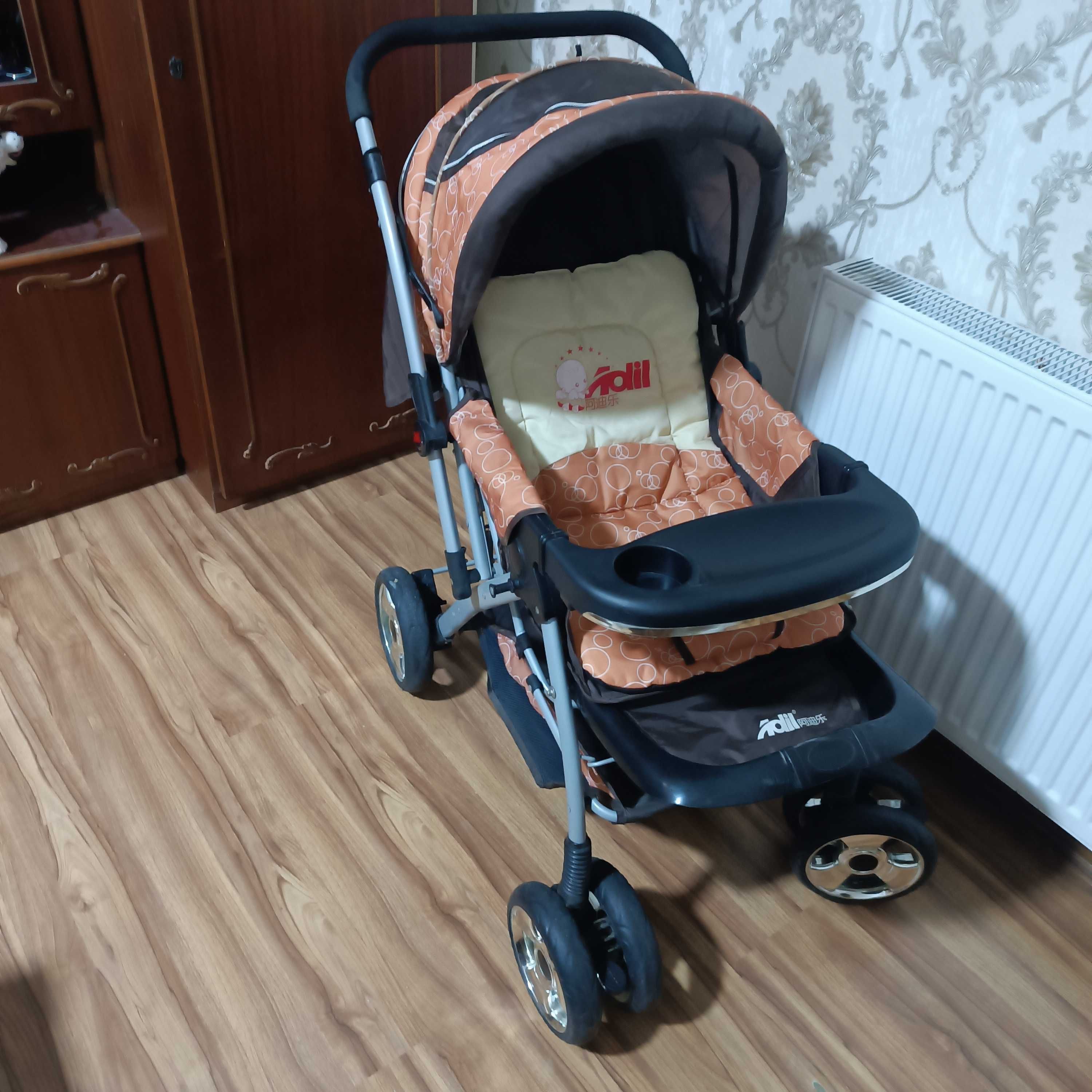 Продам детскую коляску и ходунки