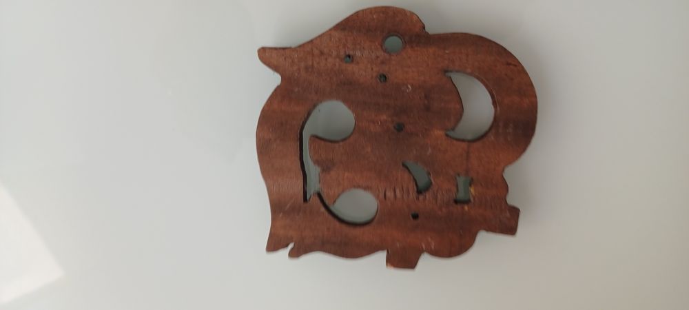 ОМ дървен символ