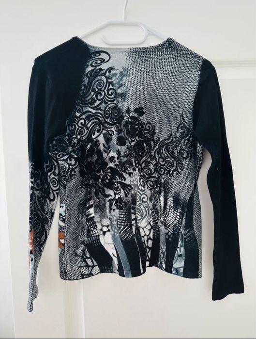 Set cardigan și bluză cu mânecă scurtă din 50% lână merinoz.