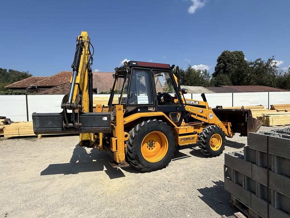 Buldoexcavator Caterpillar 428B 4x4 cu blocanti si 3 cupe