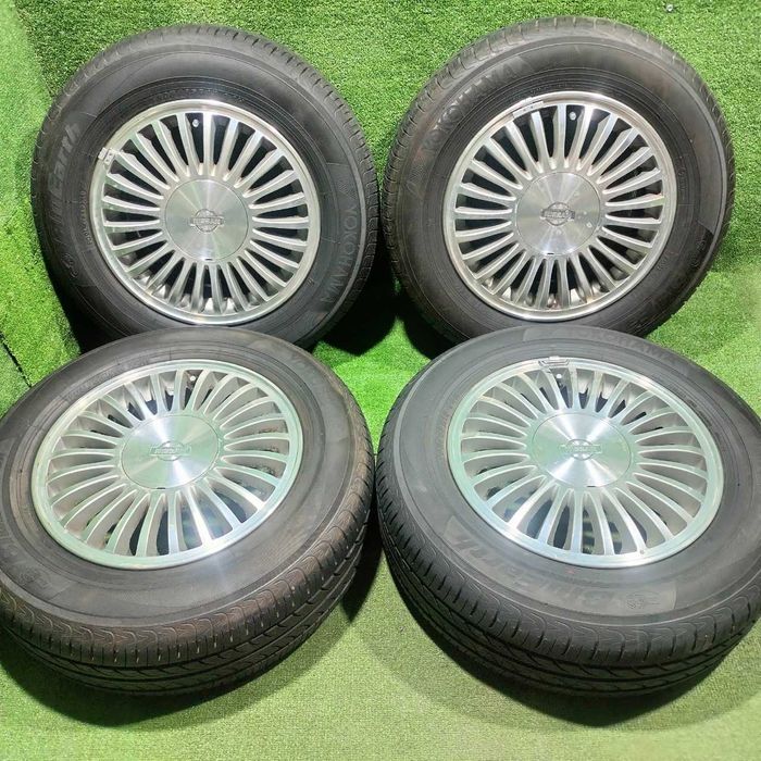 Продам Оригинальный диск Nissan Cefiro А32 с шинами летний 205/65 R15