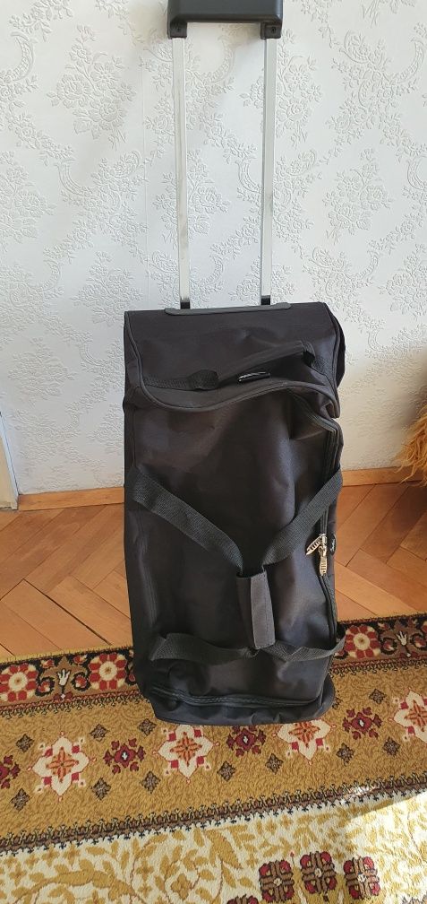 Чанта за пътуване на колела и с дръжка