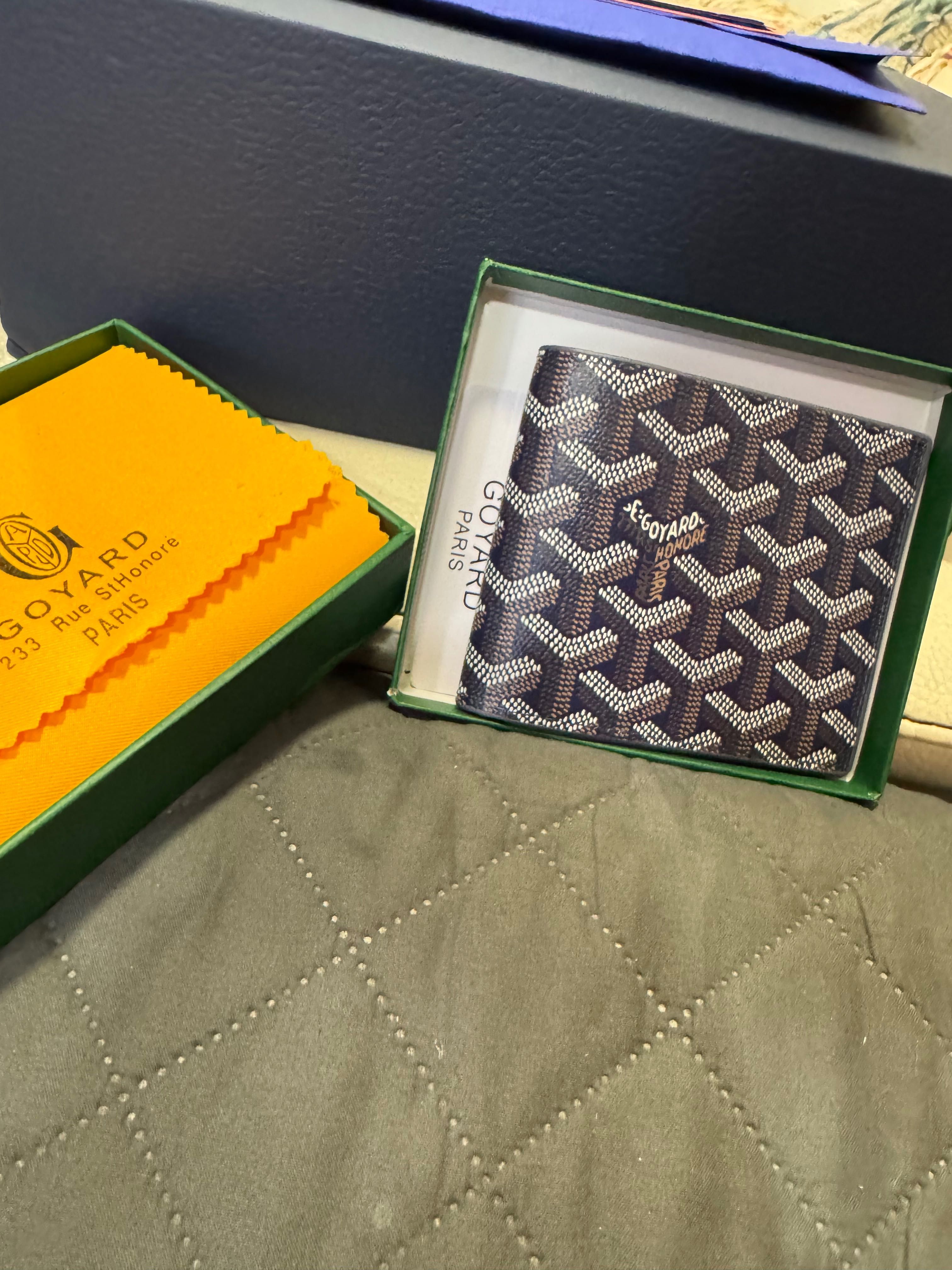 Портфейли Goyard