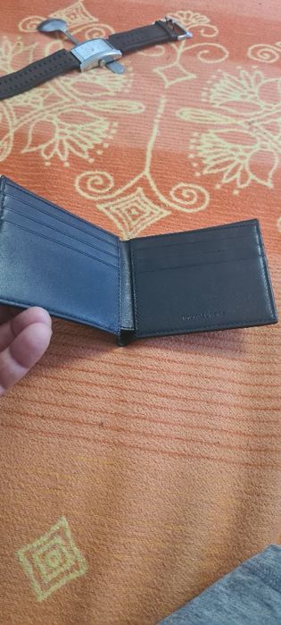 Pormoneu bărbați marca Michael kors .