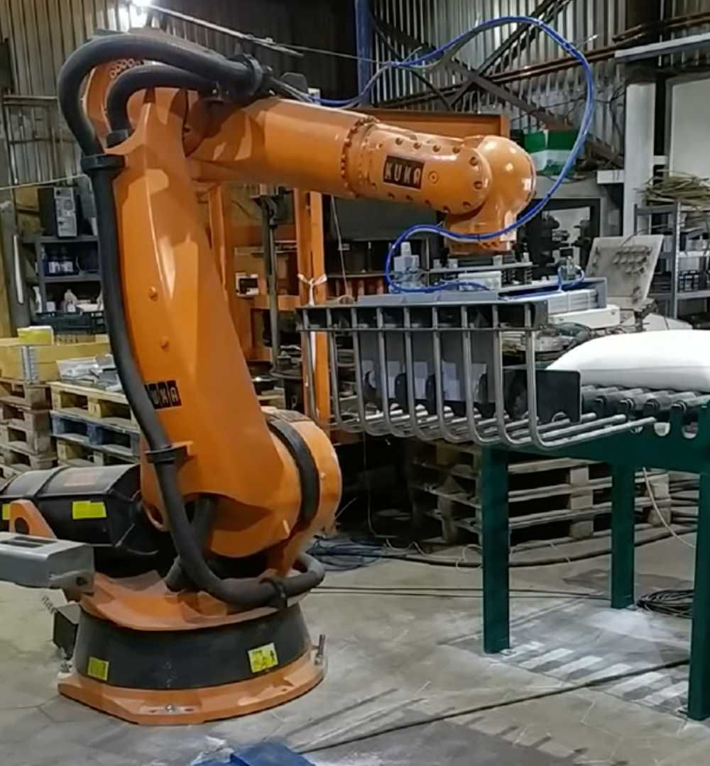 Celulă robotică completă pentru paletare saci