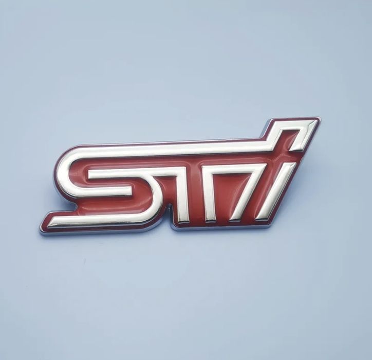 Memaʌнa емблема STI за Subaru.
Ipogykma e om Hau-Bucok kʌac.