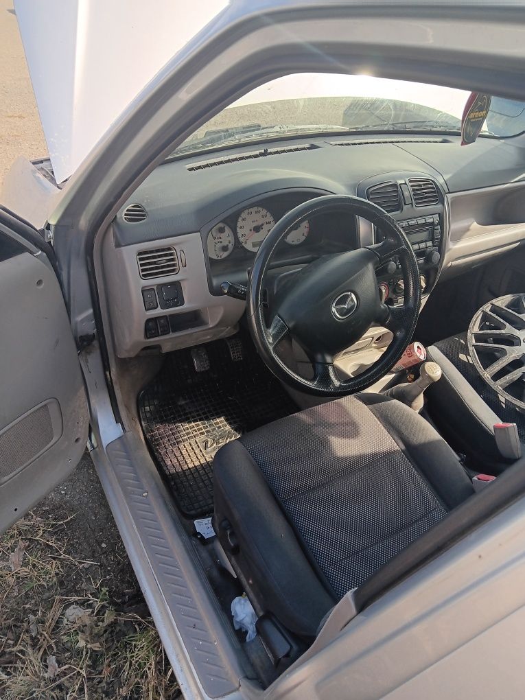 Mazda Demio 1,5 на части
