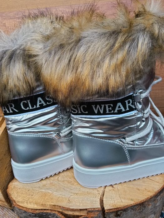 Дамски зимни апрески в сребристо сив цвят с пухче.