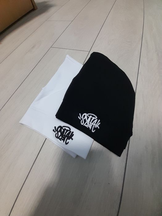 Syna world caps.