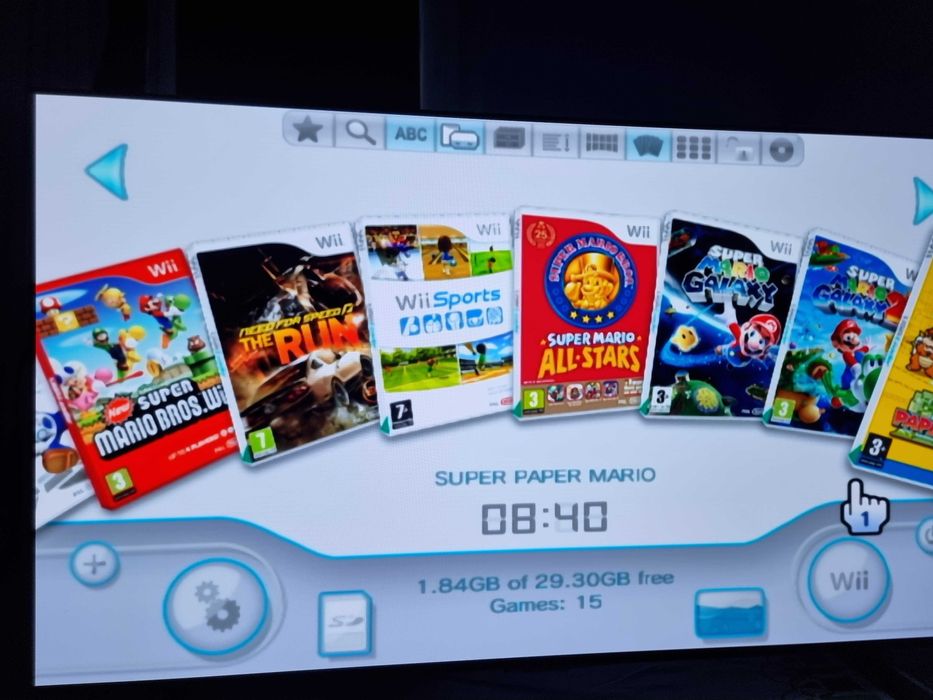 Nintendo Wii modat + stick cu jocuri