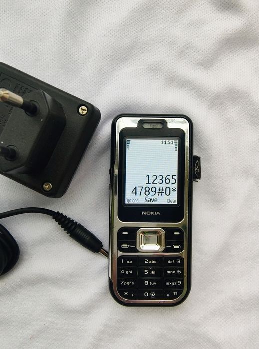 Nokia 7360 + incarcator original ( decodat, stare foarte buna)