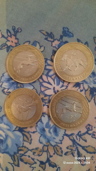 Коллекционные монеты каждая по 5 тыс.тенге