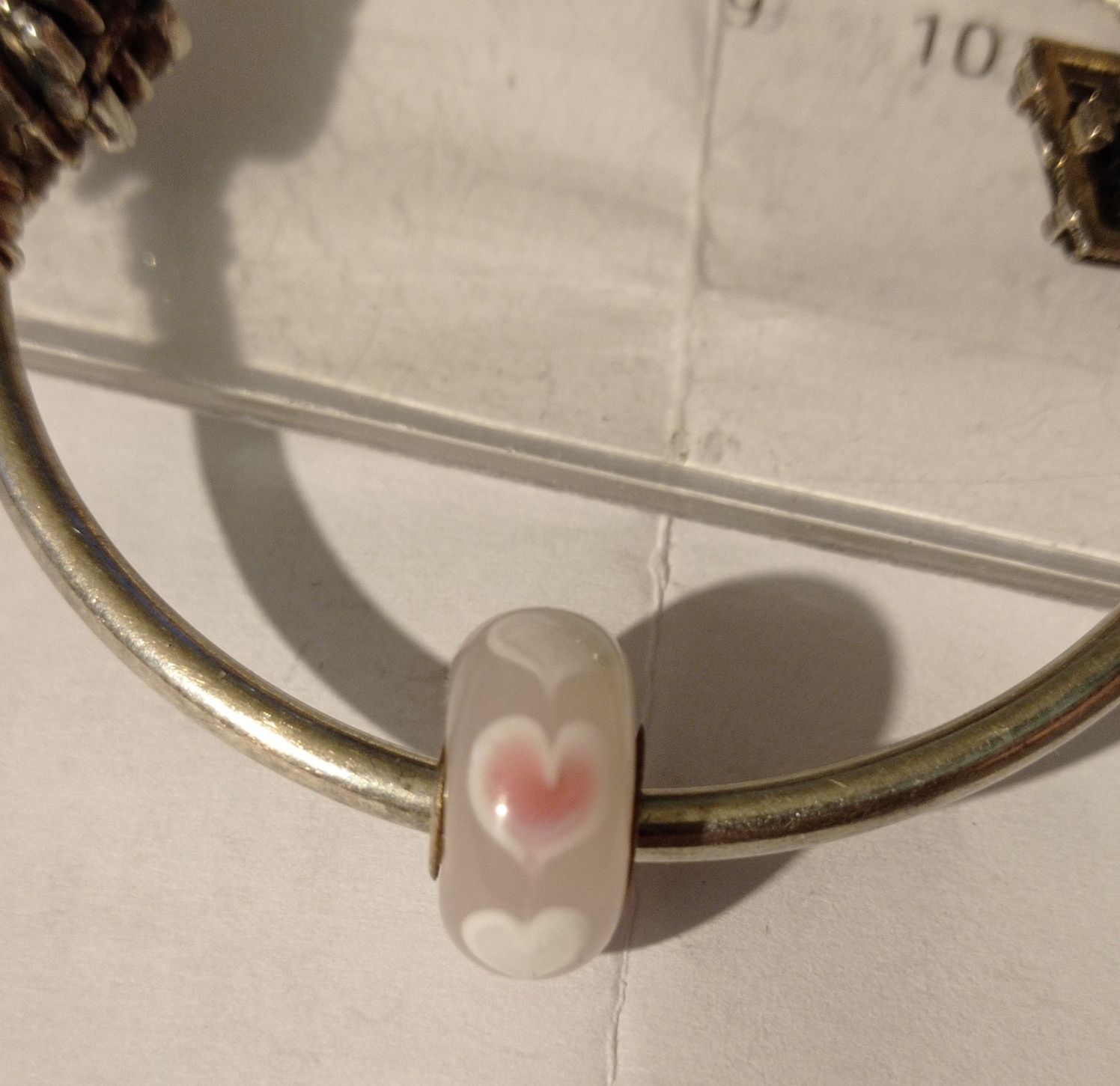 Vând/Schimb brățară Pandora-Stare conform foto,1 charm lipsă 3 pietre.