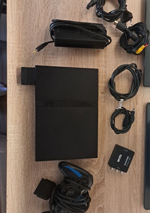 Vând ps2 slim(nu ii merge cd-rom-ul)
