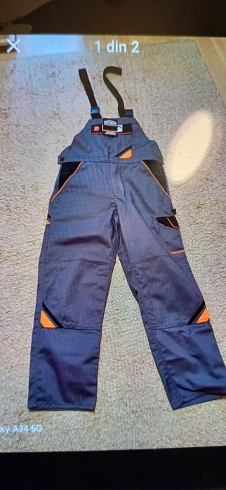 Vând salopeta marimea 52 noua culoare gri