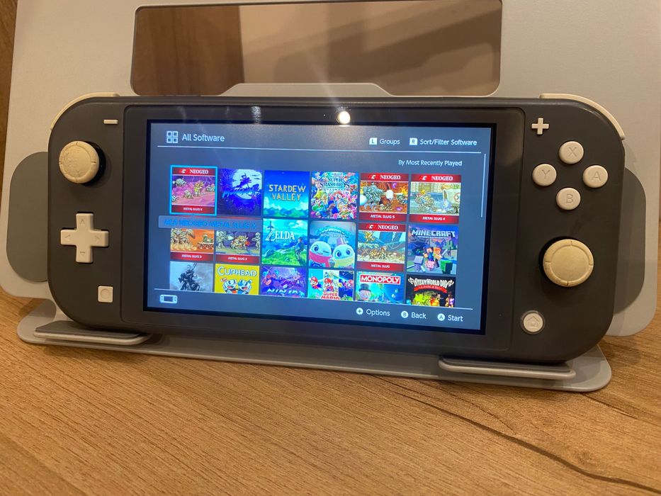 Nintendo Switch Lite – Modat + 256GB Plin cu Jocuri + Husă Originală