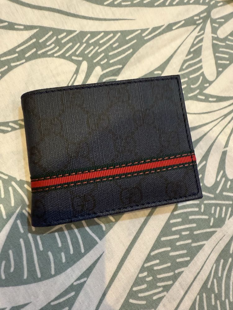 Портфейли Goyard и Gucci