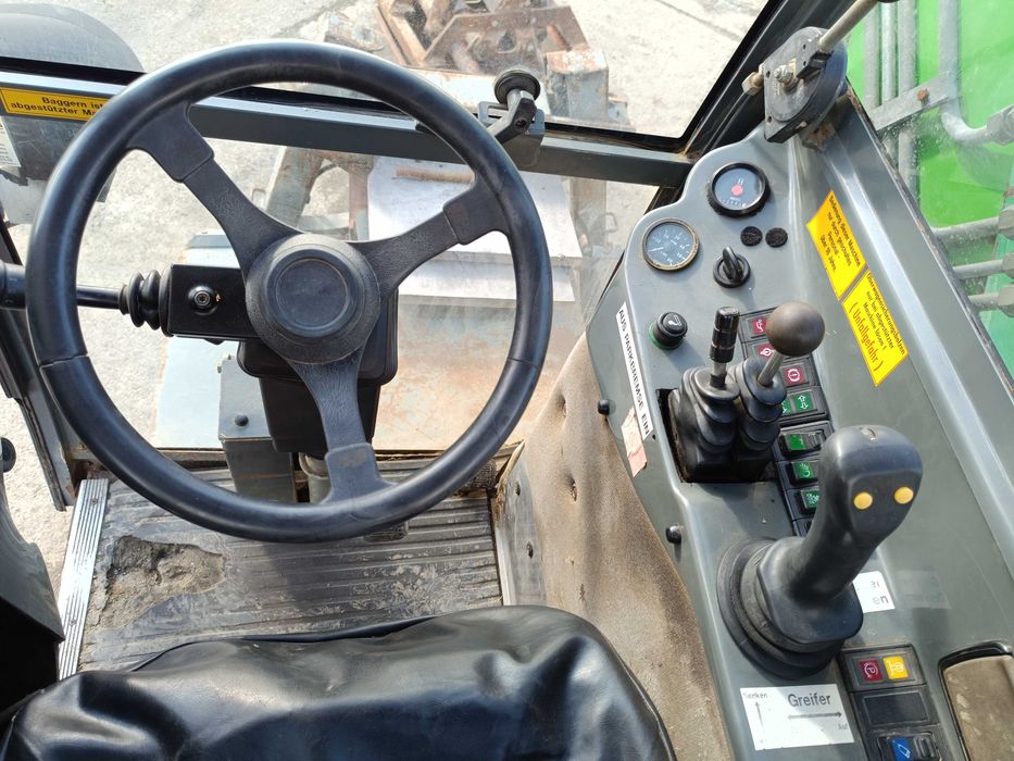 Excavator pe roți HANSA APZ 531 – 2003 – graifer hidraulic rotativ