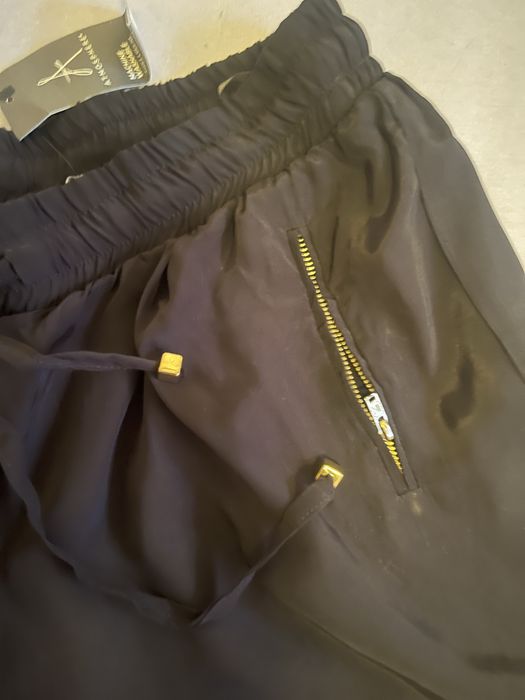 Pantaloni dama negri luciosi