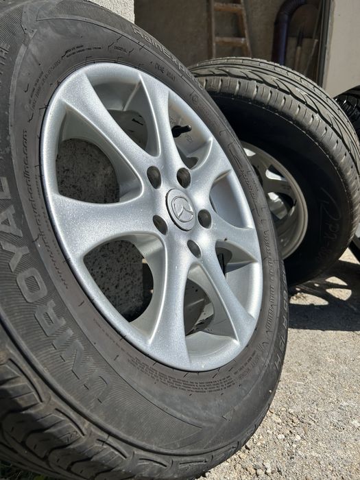 4бр. Алуминиеви джанти с гуми 195/65 R15 цола от Mazda