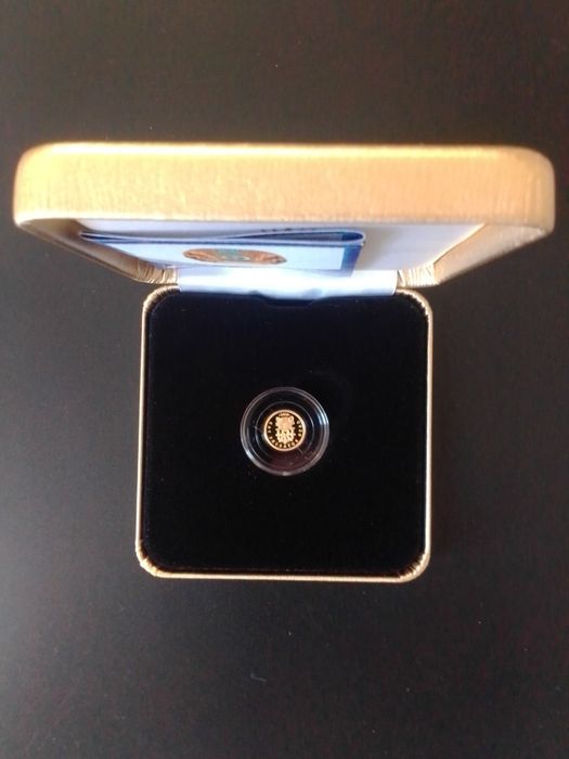 Золотая монета кошачий хищник с оленями