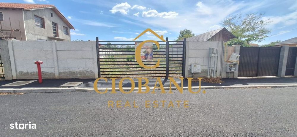 Teren intravilan imprejmuit cu gard de beton de vanzare
