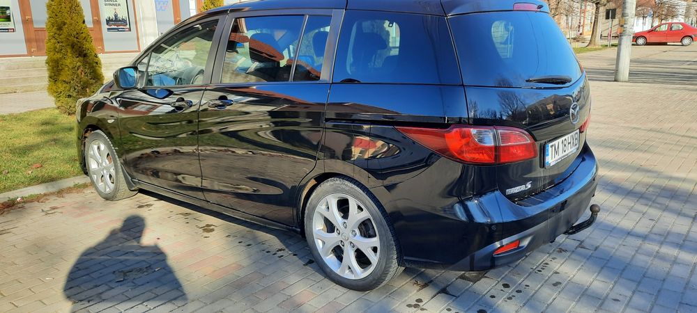 Vând Mazda noastră de Familie   ruleza excelent 7locuri  6 viteze etc.