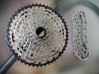 Pinioane Shimano SLX 12 Viteze /CS-M7100 + lant CN-M7100