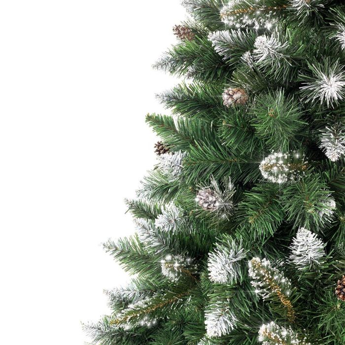 Pom de Craciun artificial cu pietre stralucitoare pe varful ramurilor