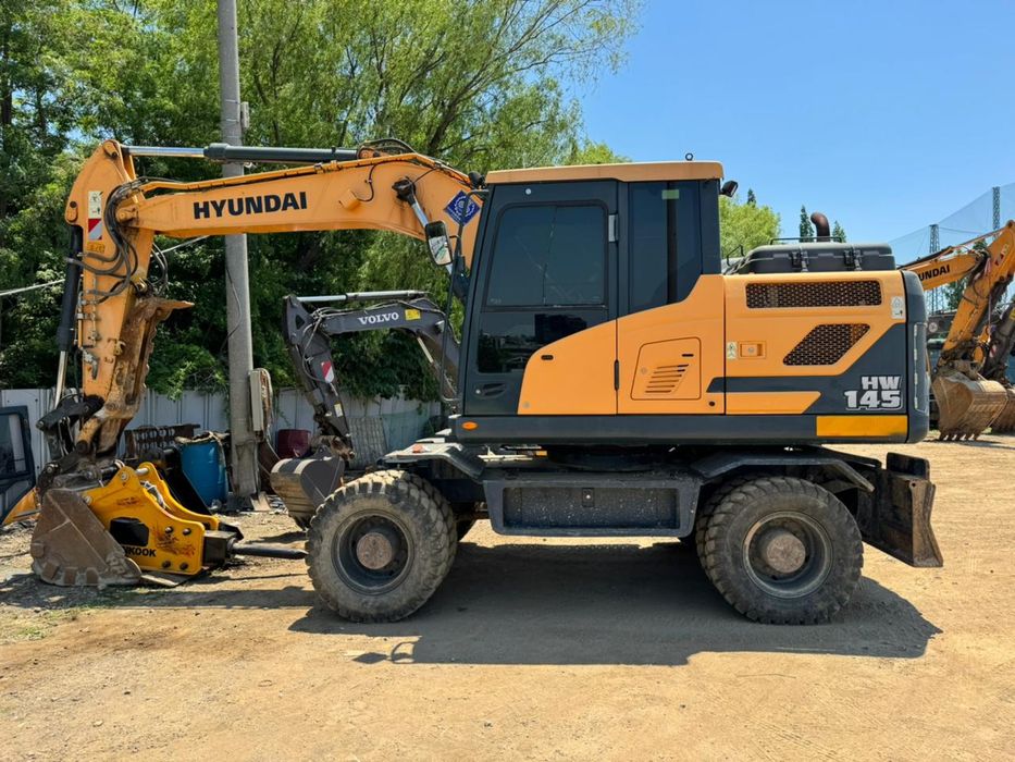 Экскаватор.Услуги колесного Экскаватора.Гидромолот