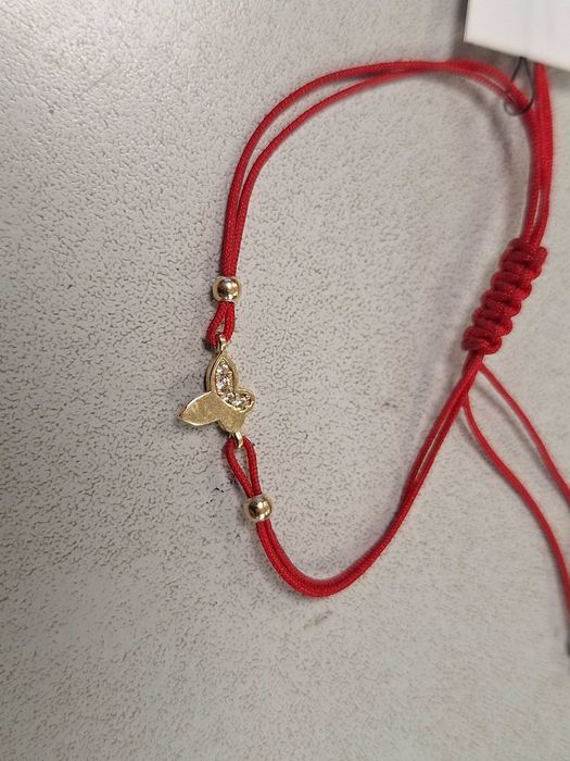 Златна гривна с червен конец 1,02гр.