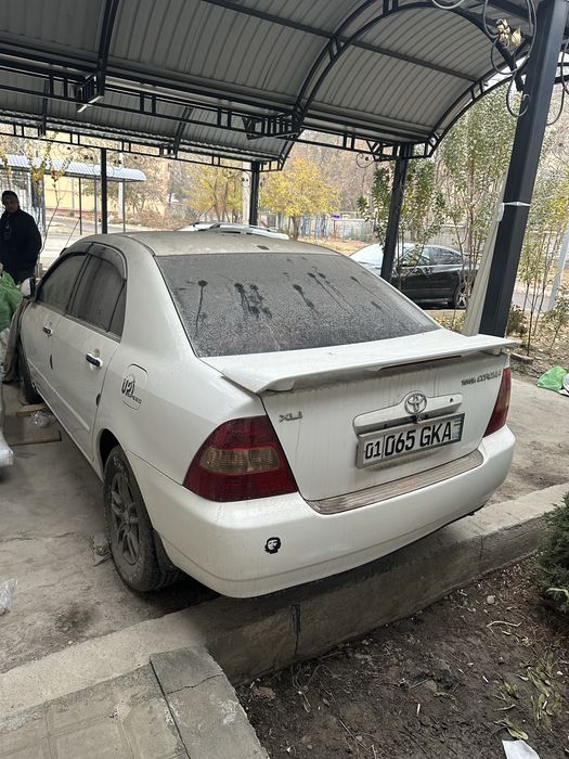 Тойота королла 2002 года