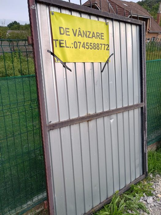 Vând poarta detalii la telefon