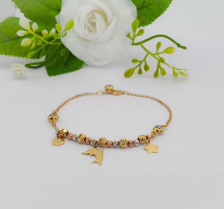 Brățară din aur 14K cu bile bicolore și accesorii delfin etc ...