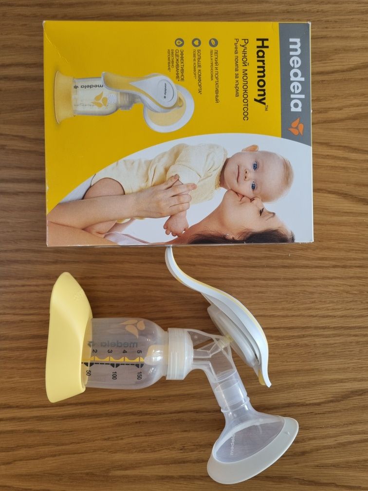 Еднократно ползвана ръчна помпа Medela + подарък термобокс Miniland