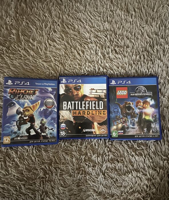 Диски на пс4 Rachet Clank, Battlefield Hardline, Lego Мир Юрского.
