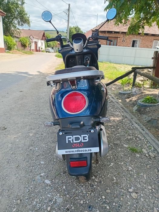 Schimb scuter electric cu mașina