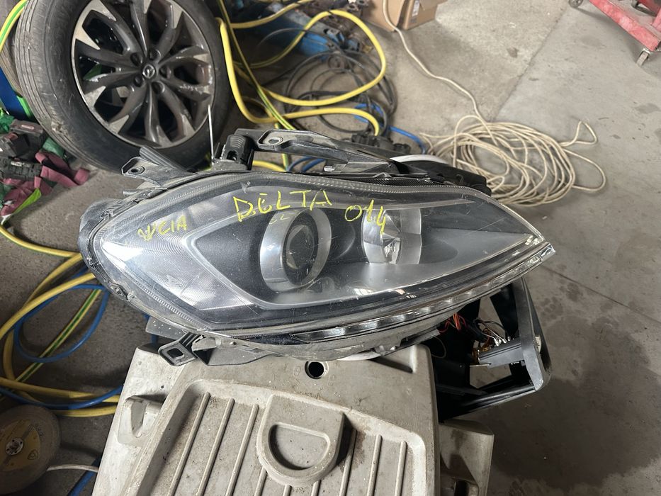 Faruri Lancia Delta 2014 cu LED impecabile