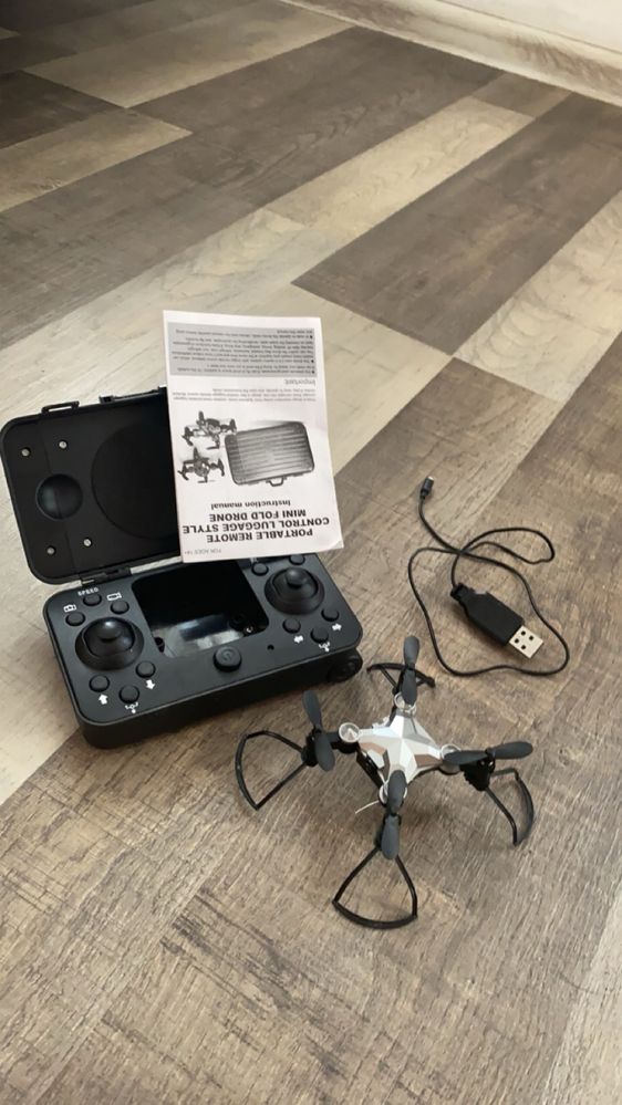 Portable remote control luggage style mini fold drone + camera