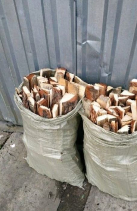 Дрова в.   мешках