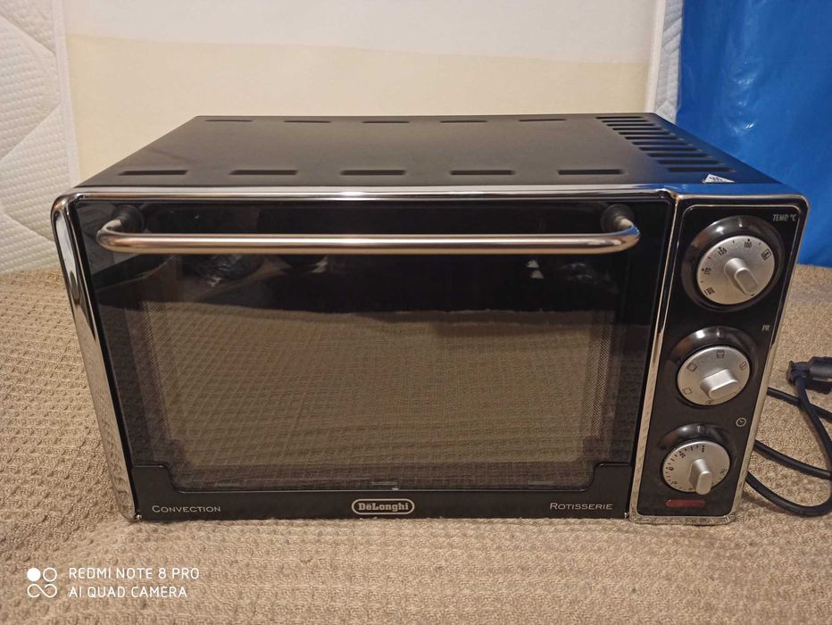 Cuptor electric Delonghi, 20 litri, 7 functii de gatit, 1300W. (NOU)